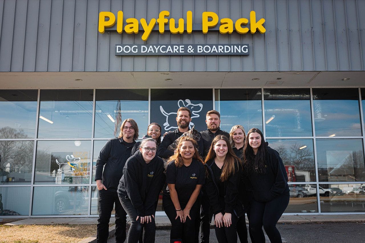Picture of the Playful Pack team in front of one of their locations